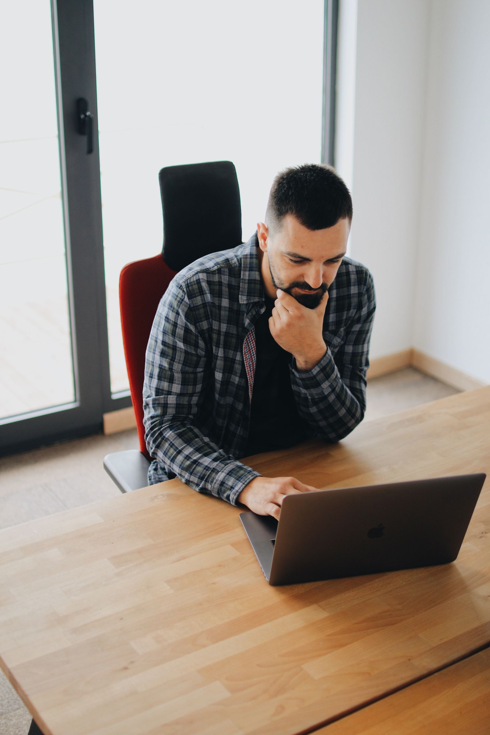 Professional reviewing work on a laptop